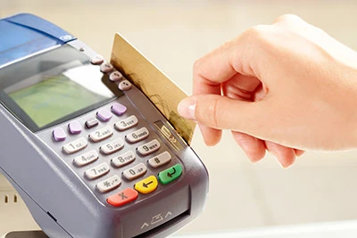 person swiping a credit card