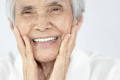woman with dentures from Optima Dental in Lawrenceville, GA