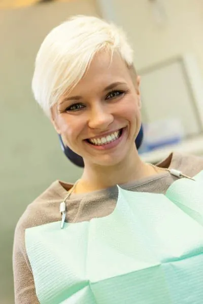 woman smiling during her dental appointment