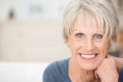 woman with a dental bridge from Optima Dental
