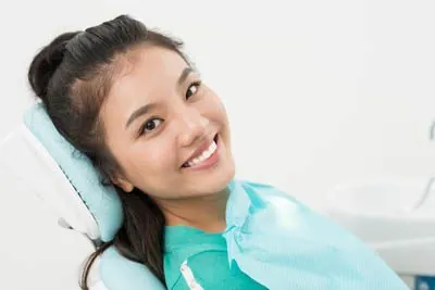 woman smiling at Optima Dental