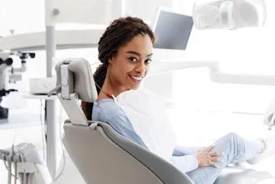 woman smiling during her visit to Optima Dental in Lawrenceville, GA