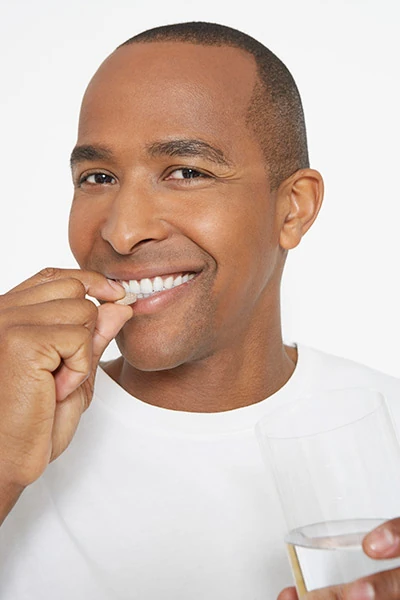 man taking a sedative before his dental procedure
